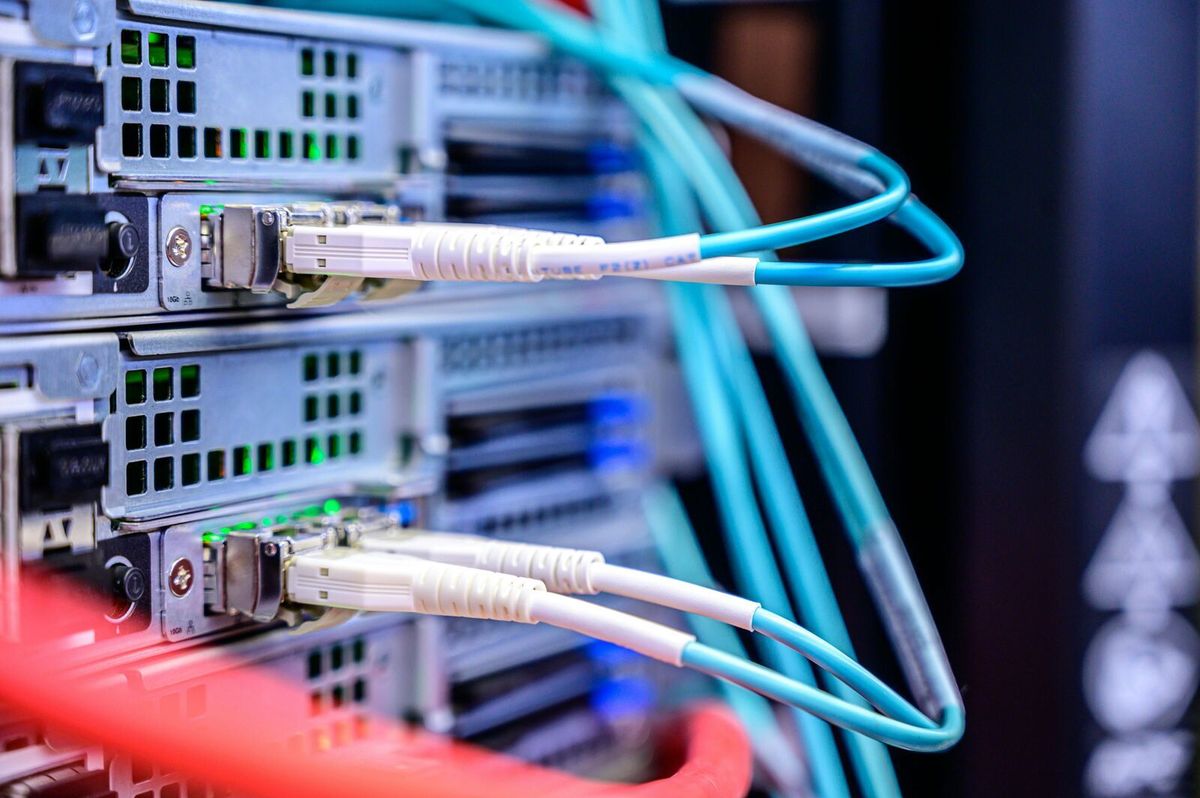 Server racks inside a data center data hall protected by layered physical security