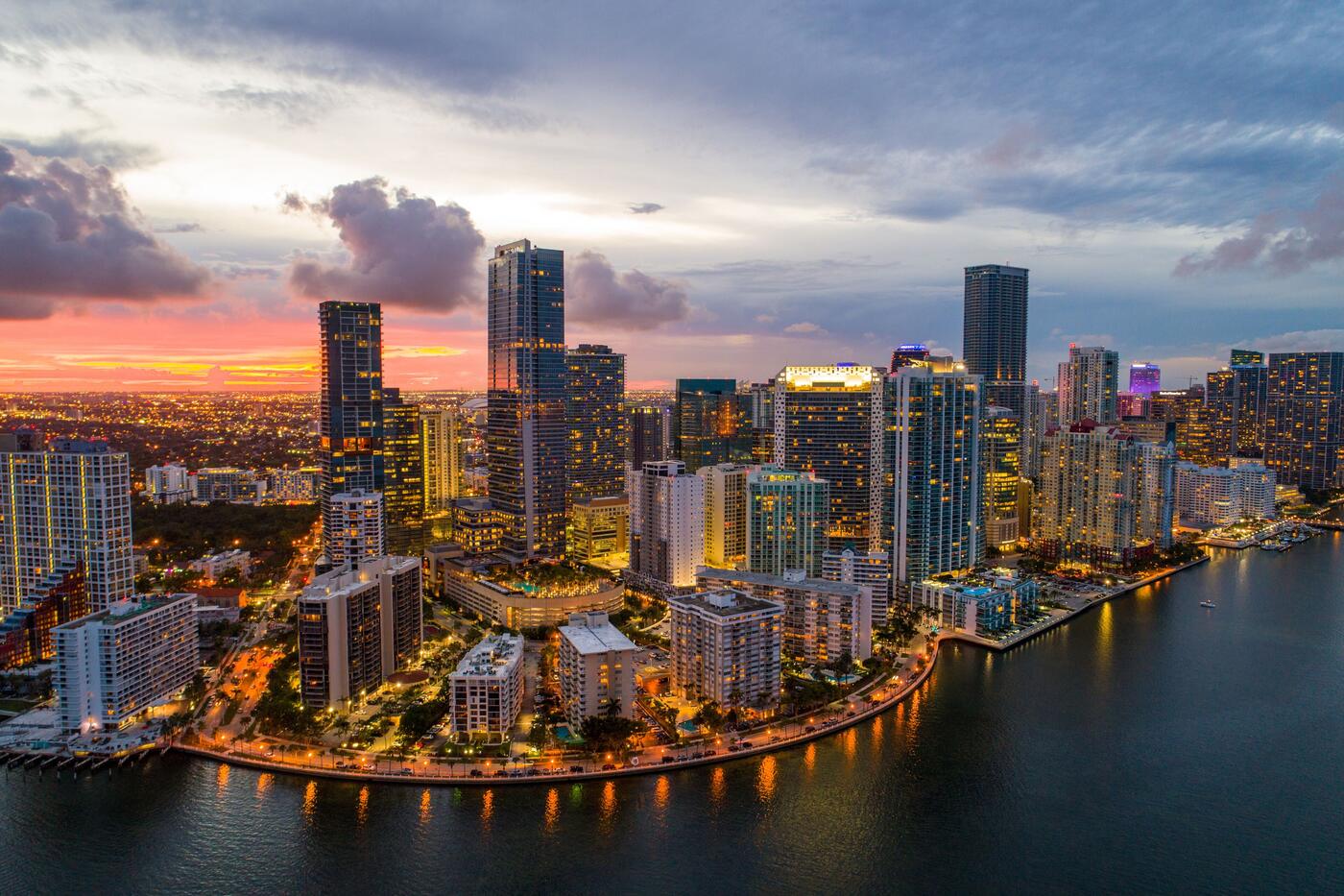 Aerial view of Miami's Brickell financial district skyline at dusk, home to the finance, law, and trade firms Red Cell Solutions protects