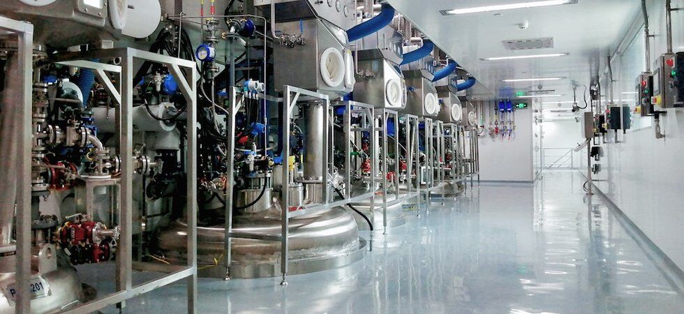 Pharmaceutical manufacturing equipment inside a controlled production facility